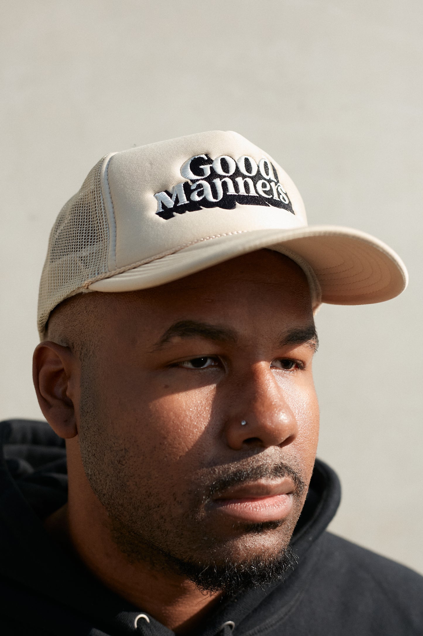 Tan Good Manners Logo Trucker Hat